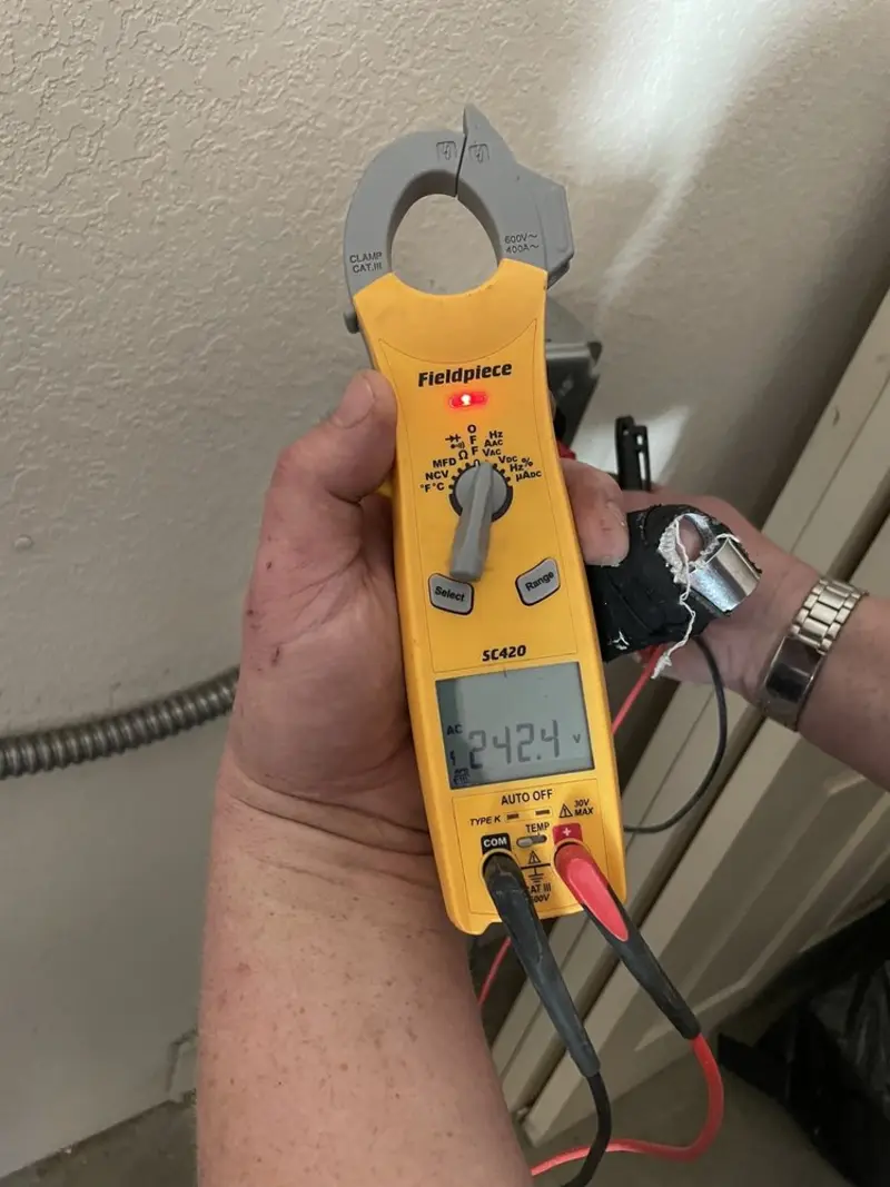 Voltage testing with clamp meter during Whole House Surge Protector in Franklin Farm